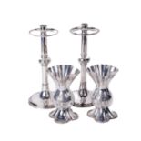 A pair of fine quality silver plated Arts and Crafts pillar Candlesticks, with circular drop tray on