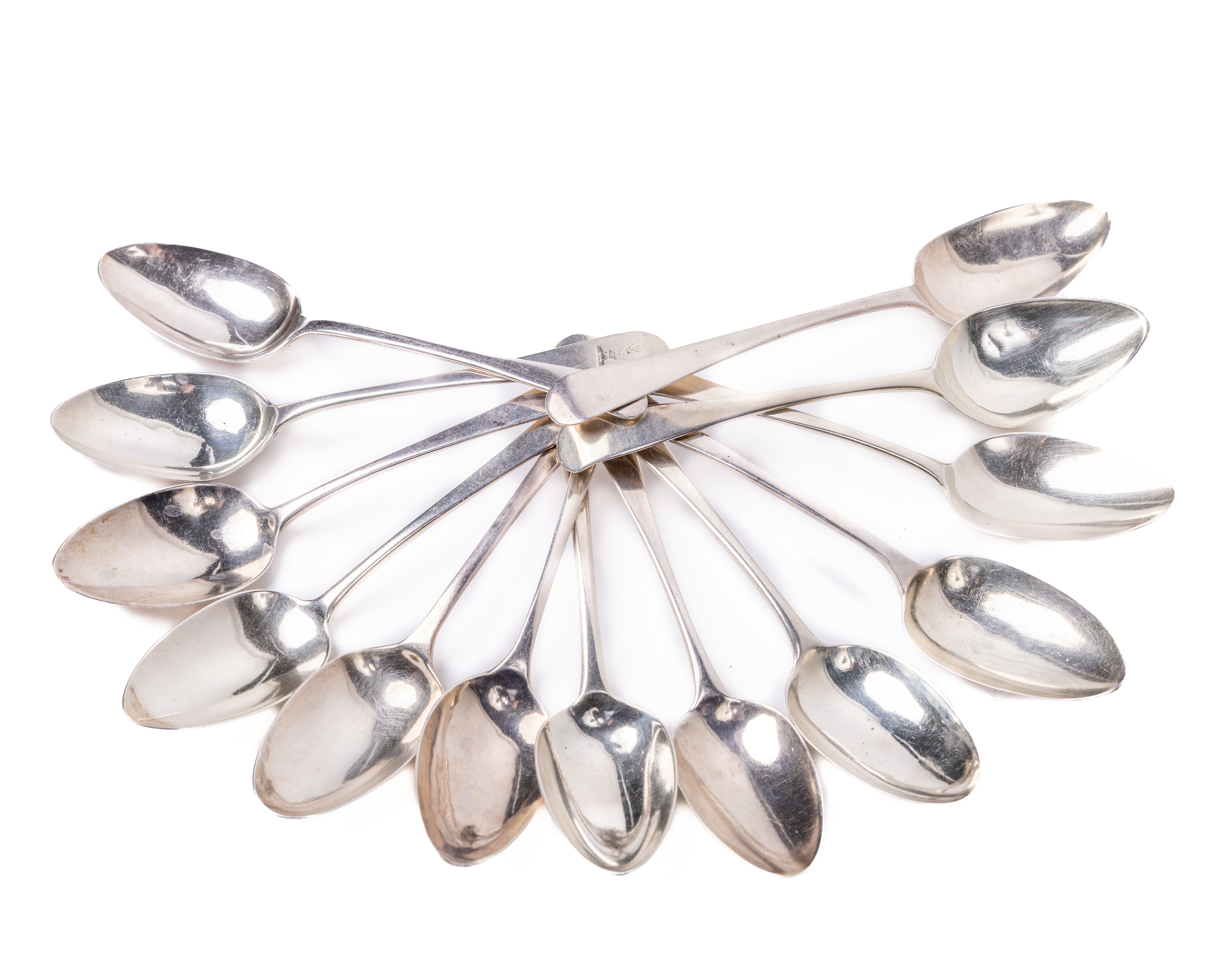 A varied collection of 12 Irish & English Dessert Spoons, various hall marks and makers, some