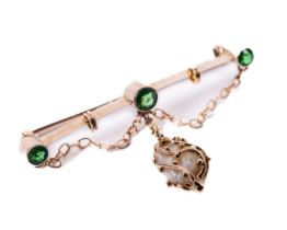 An attractive 9ct gold Ladies Bar Brooch, set with three emerald type stones, and a gold strap fresh