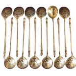 A set of 12 fine Russian Imperial Niello work and silver gilt Caviar Spoons, makers mark B.C. 84,