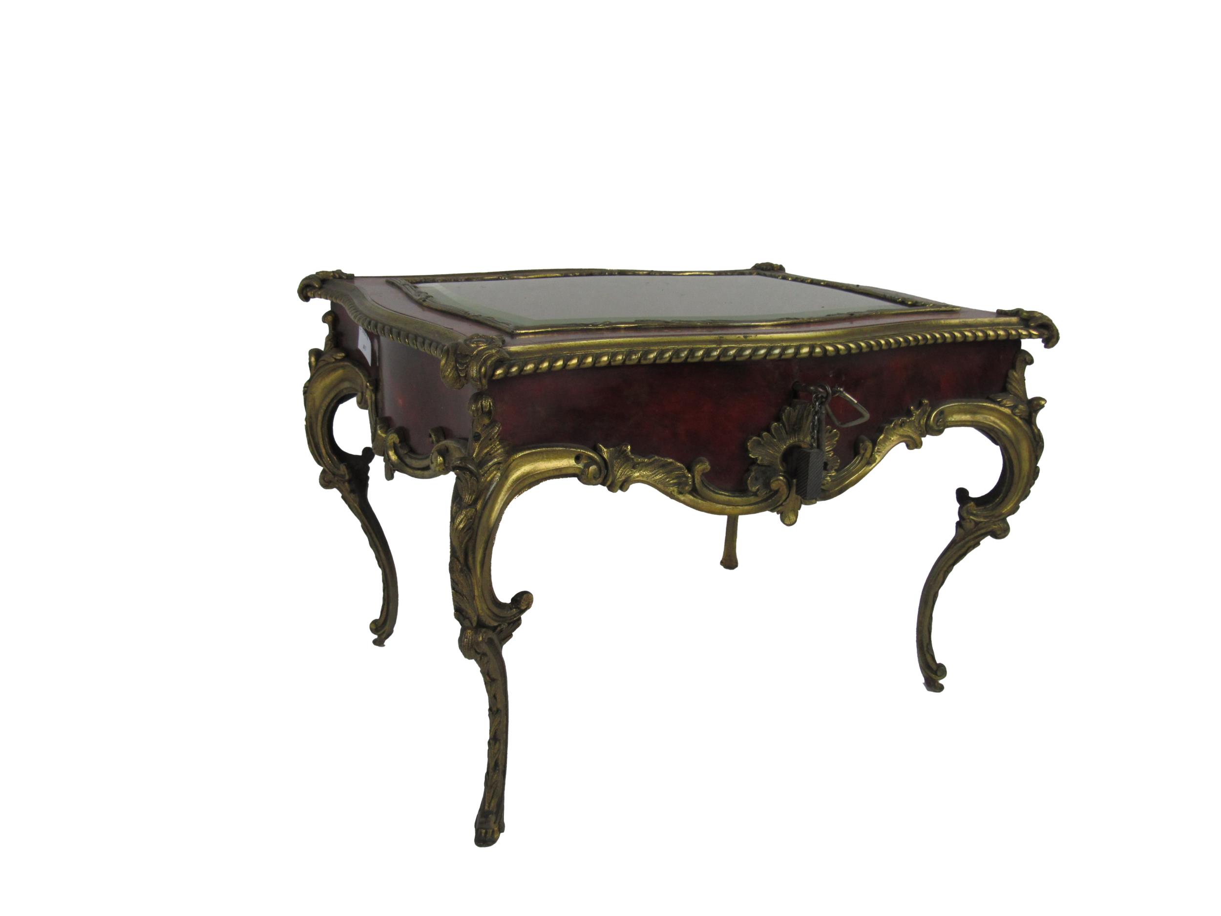 An attractive French Louis XVI style ormolu mounted table top Curio Cabinet, the shaped lift top