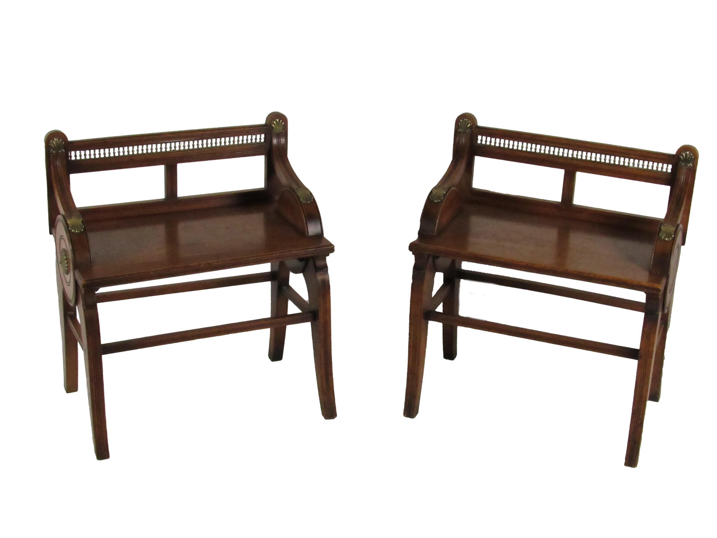 A pair of Victorian oak Hall Seats, attributed to Joe Shoolbred & Co., each back with two open