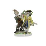 A large Meissen Group, with gentleman in bright yellow coat, and a Jester in green coat, offering