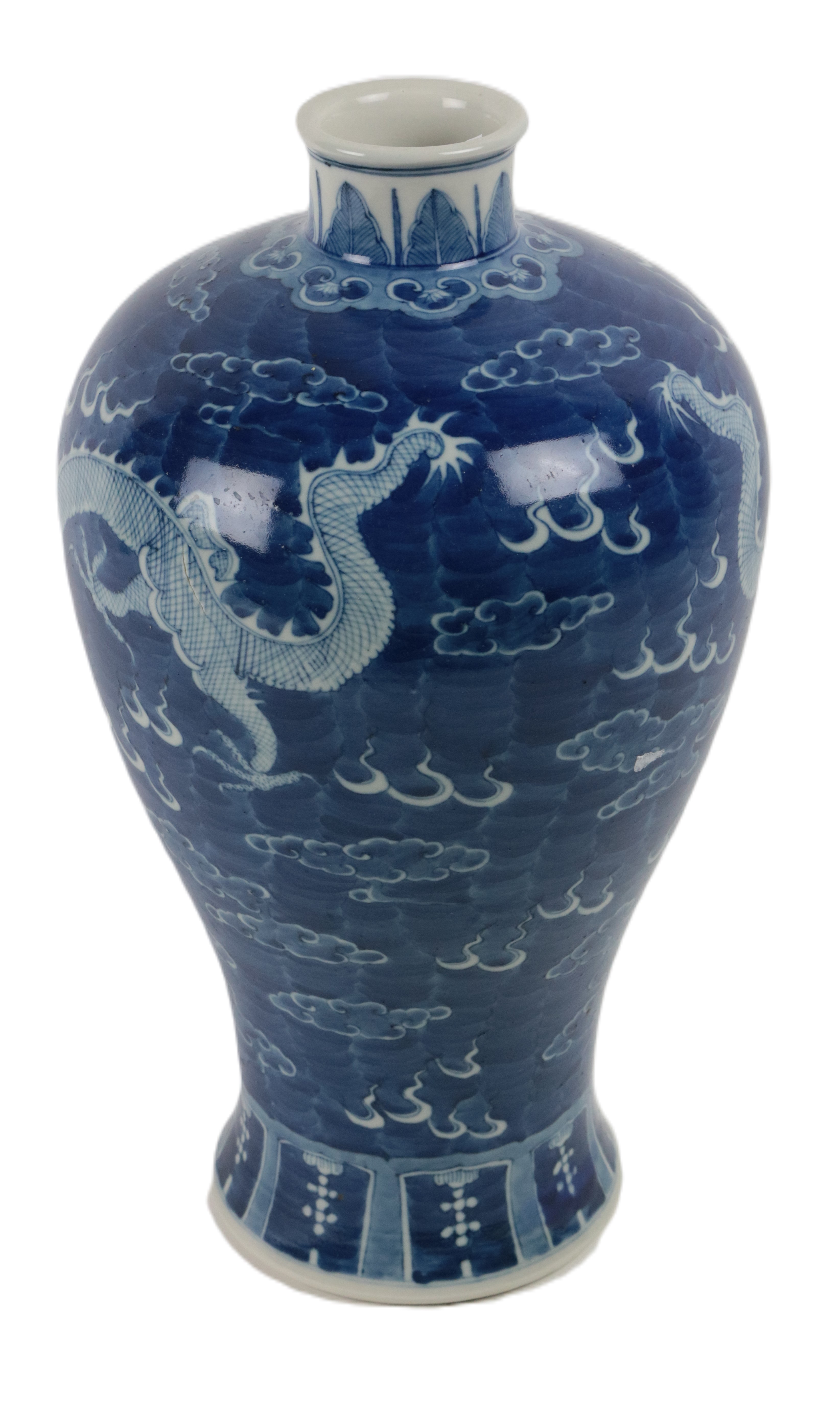A large Chinese blue and white bulbous shaped 'Dragon Vase,' decorated with floating dragons,