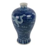 A large Chinese blue and white bulbous shaped 'Dragon Vase,' decorated with floating dragons,