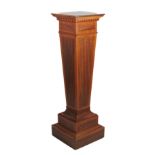 An attractive inlaid mahogany and ebony strung pedestal Stand, the square top over dentil moulding