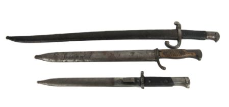Militaria: A group of three early 20th World War I & II steel Bayonets, with variant wooden grip