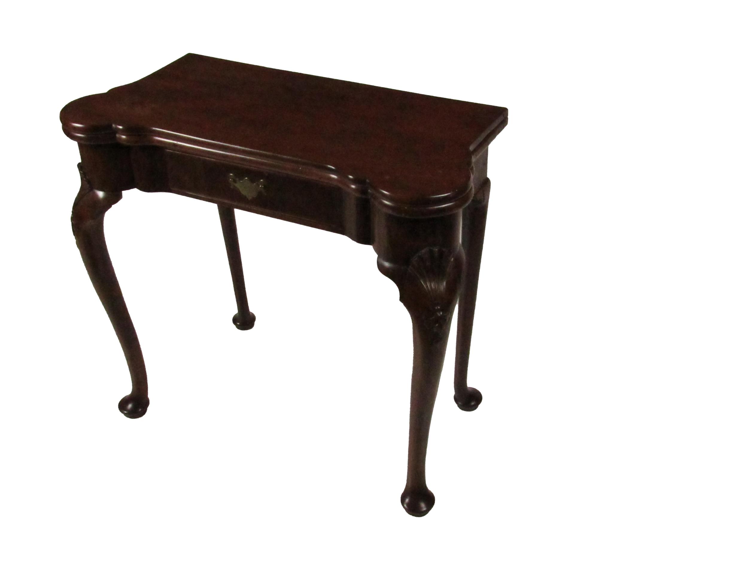 An Irish Georgian period mahogany fold-over Card Table, the shaped top opening to reveal a baize