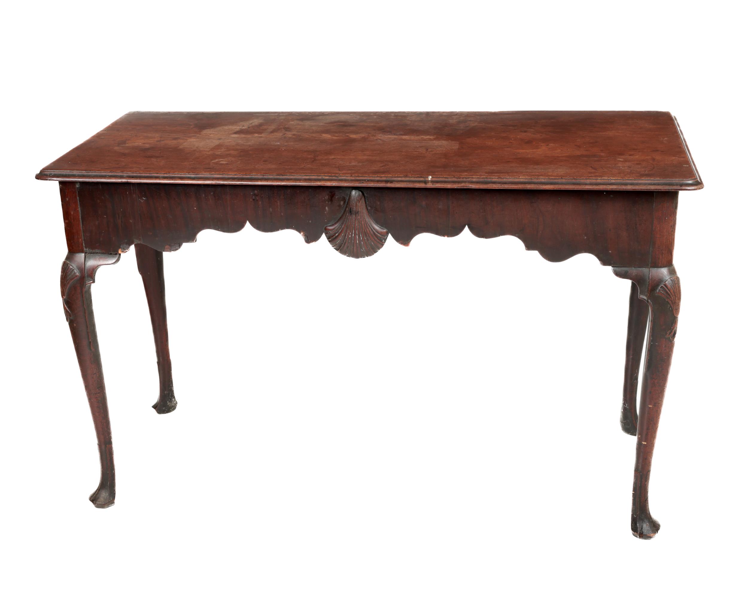 A fine quality 19th Century Irish mahogany Side Table, the plain moulded top over a shaped frieze