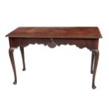 A fine quality 19th Century Irish mahogany Side Table, the plain moulded top over a shaped frieze