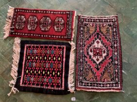 3 small patterned rugs
