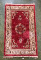 Red/cream patterned rug