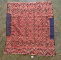 Red/blue/cream patterned rug