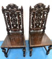 Pair of carved hall chairs