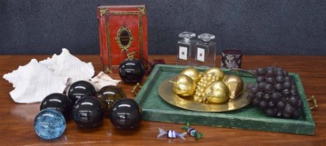 Mixed group of decorative items to include six glass globe paperweights, four sea shells, group of