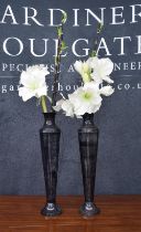 Pair of decorative tall slender metal vases in a simulated marble finish, 23.5" high, with some faux