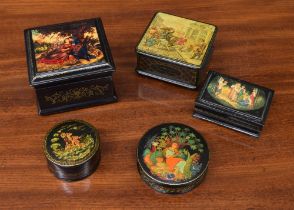 Five Russian lacquered boxes, three of which are hand painted and signed, the others transfer