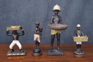 Small bronze figural candlestick, cast as a boy wearing a turban, 10" high; together with a resin