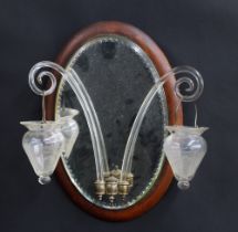 Venetian girandole oval mirror, the glass with an elliptical cut border, mounted on a wooden plaque,