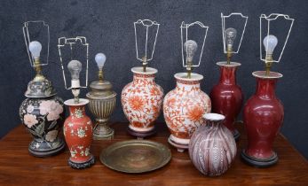 Group of Chinese porcelain vases converted to table lamps; also a pottery table lamp in the form