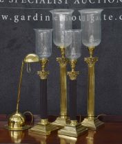 Two pairs of brass Corinthian column table lamps, all with glass storm shades, one pair 30" high and