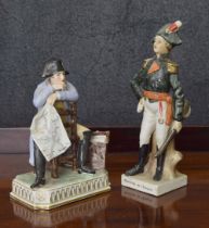 Dresden Potschappel porcelain figure of a seated Napoleon, holding a document and with a satchel