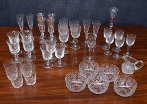 Group of foliate etched drinking glasses various; including flutes, tumblers, wine glasses etc; also