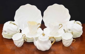 Coalport porcelain tea wares comprising two cream jugs, twelve teacups and saucers, twelve plates