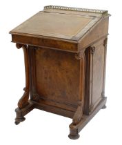 Victorian walnut Davenport, the hinged sloping top with inset tooled leather writing surface