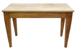 Farmhouse kitchen table, the plank top over a frieze with two opposing short drawers raised on