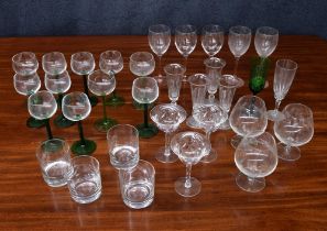 Group of drinking glasses various; brandy snifters, green stem wine glasses, facet stem coupes,