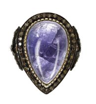 Pear-shaped cabochon tanzanite and diamond-framed ring set in gold plate silver, the tanzanite 10.