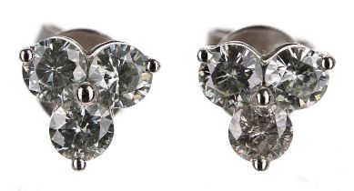 Pair of modern 14ct white gold trilogy diamond earrings, round brilliant-cuts, 0.90ct approx in