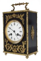 French two train mantel clock striking on a bell, the 3.5" white dial within an ebonised case with