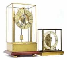 Modern brass electric mantel clock, the 6.25" brass dial enclosing a skeletonised movement,