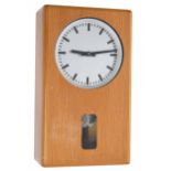 Moser Baer electric master wall clock with programmer, the 6" silvered dial over a pendulum window