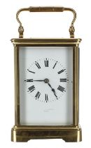 French carriage clock striking on a gong, the dial indistinctly signed, within a corniche brass