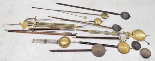 Large quantity of longcase clock rods and pendulums; also a quantity of smaller pendulums and bobs