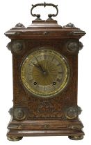 German gothic oak ting-tang mantel clock, the W & H movement striking on two gongs, the 4.75" silver