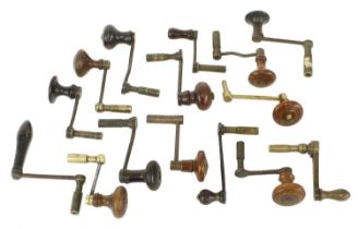 Fifteen various brass and iron crank handle clock keys with turned wooden handles (15)