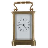 French brass carriage clock striking on a bell, within a corniche brass case, 6.5" high (key);