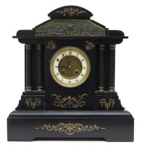 French black slate two train mantel clock striking on a gong, the 3.75" cream chapter ring enclosing