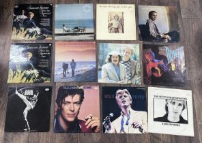 Selection of vinyl records including Simon & Garfunkel, David Bowie, Tom Petty, The Police and Bruce