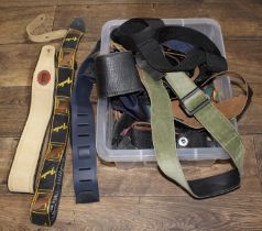 Selection of various guitar straps, including Fender and Gibson