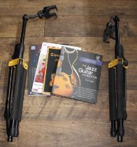 Two Hercules guitar stands; together with four guitar books to include Rod Fogg - 'The Jazz Guitar