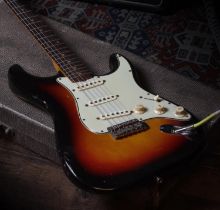 1963 Fender Stratocaster electric guitar, made in USA; Body: sunburst finish with wear consistent