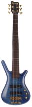 1996 Warwick Corvette Pro Line six string bass guitar, made in Germany; Body: trans blue figured