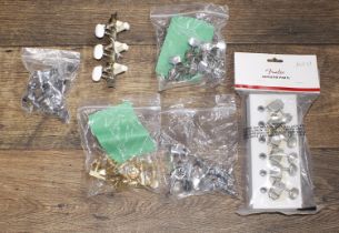 Selection of guitar tuning pegs to include a set of Fender Genuine Parts Kluson type tuners, a set