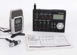 Tascam DP-004 portable four track digital pocket studio; together with a Zoom H2 handy recorder (