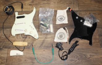 Selection of guitar pickups to include two Shadow acoustic sound holes pickups, two Busy Bee contact